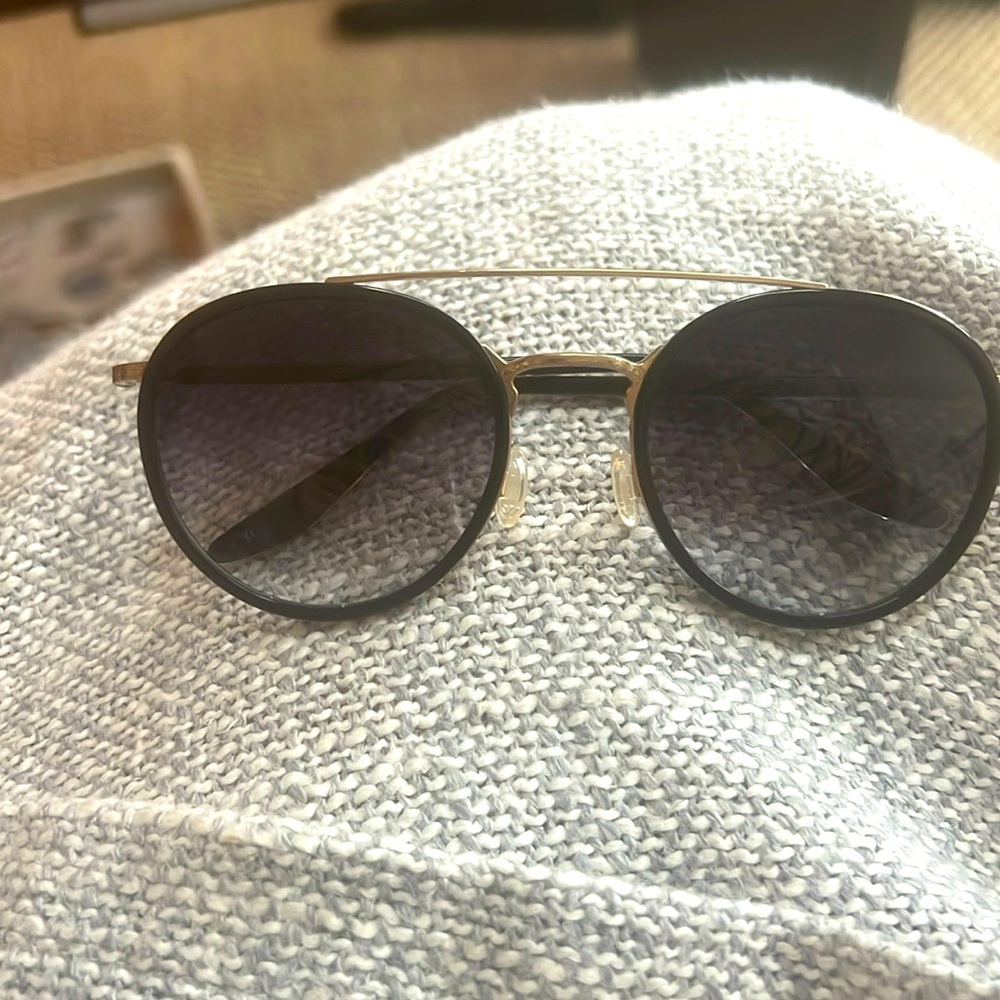 Barton Perreira Justice Sunglasses
Black lenses champagne frames